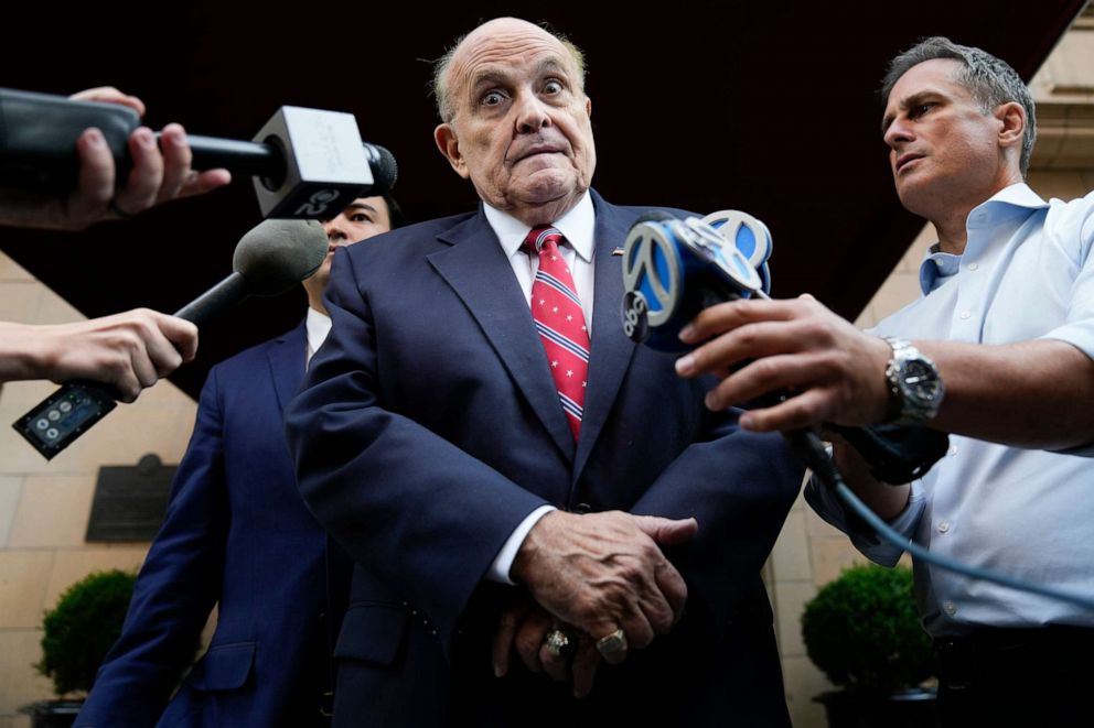 PHOTO: Former Mayor of New York Rudy Giuliani speaks to reporters as he leaves his apartment building in New York, Wednesday, Aug. 23, 2023.