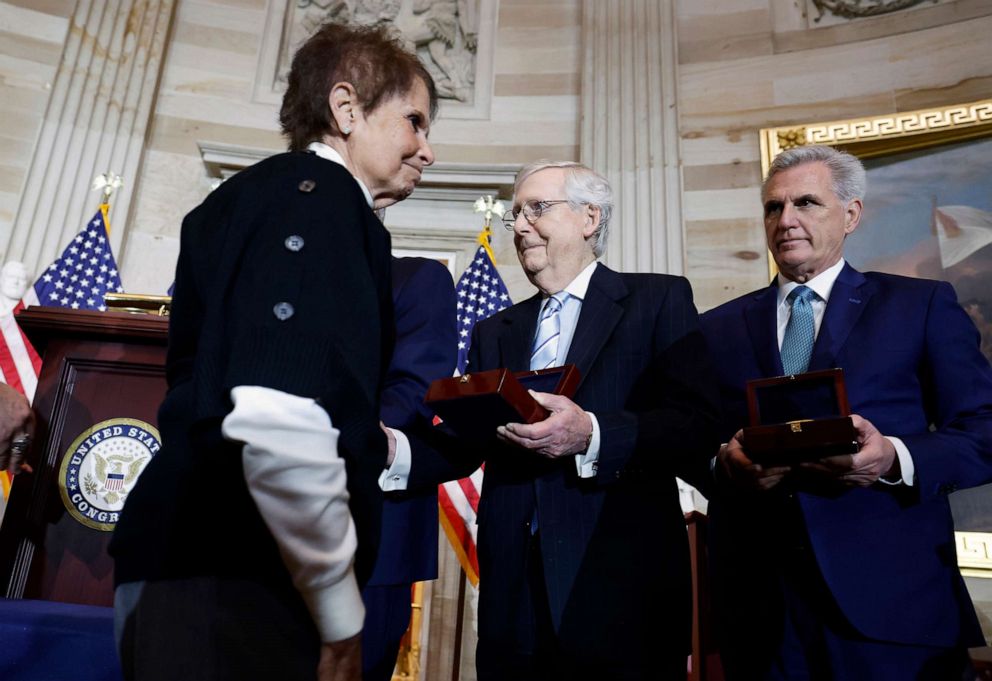 Gladys Sicknick, the mother of ousted Capitol Police officer Brian Sicknick, walks past Senator Minority Leader Mitch McConnell and House Minority Leader Kevin McCarthy without shaking hands during a handover ceremony of the Congressional Gold Medal on Capitol Hill, Dec.  6, 2022.