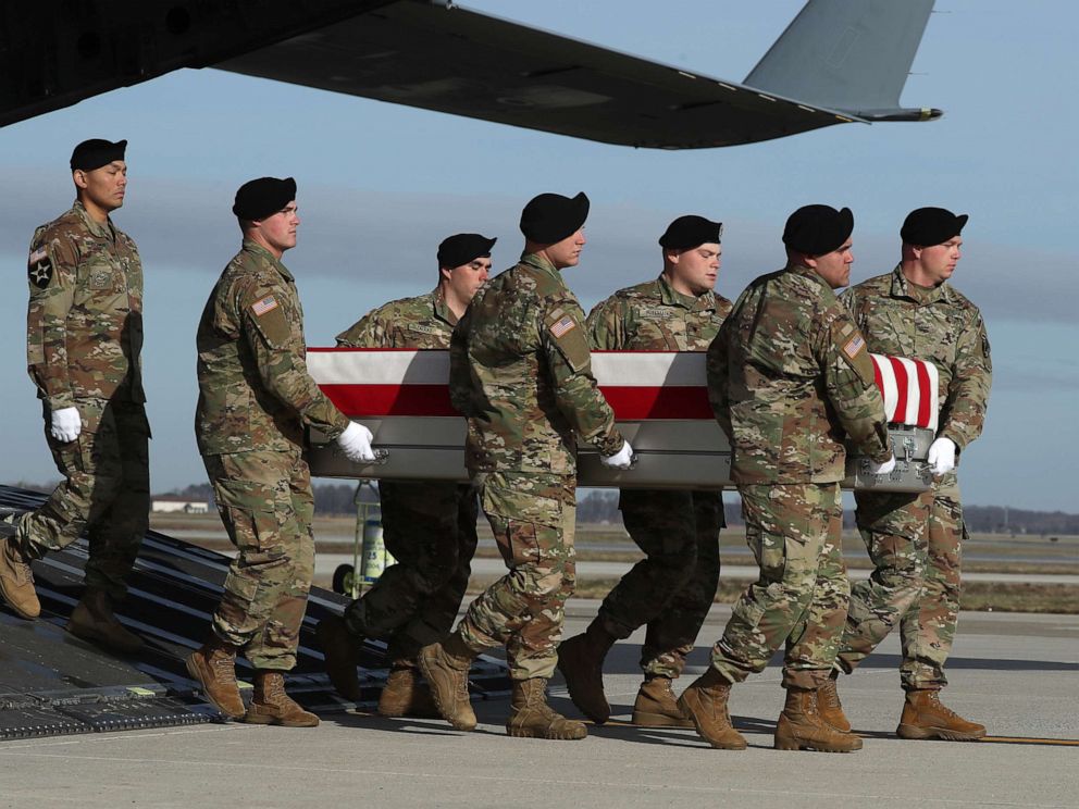 PHOTO: A U.S. Army carry team moves the transfer case containing the remains of Army Sgt. 1st Class Michael Goble during a dignified transfer at Dover Air Force Base, Dec. 25, 2019, in Dover, Delaware.