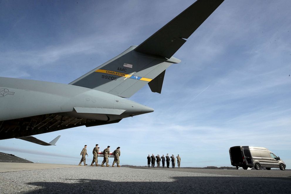 PHOTO: A U.S. Army carry team moves the transfer case containing the remains of Army Sgt. 1st Class Michael Goble during a dignified transfer at Dover Air Force Base, Dec. 25, 2019, in Dover, Delaware.