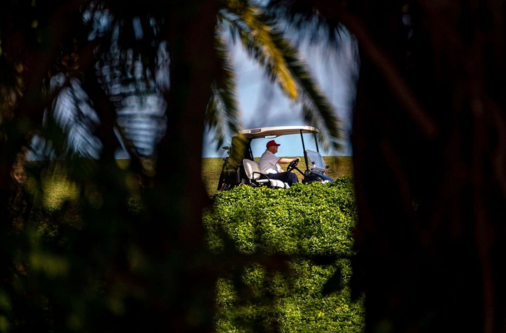 PHOTO: President Donald Trump drives his golf cart to the next hole at his Trump International Golf Club in West Palm Beach, Fla., Dec. 28, 2020.