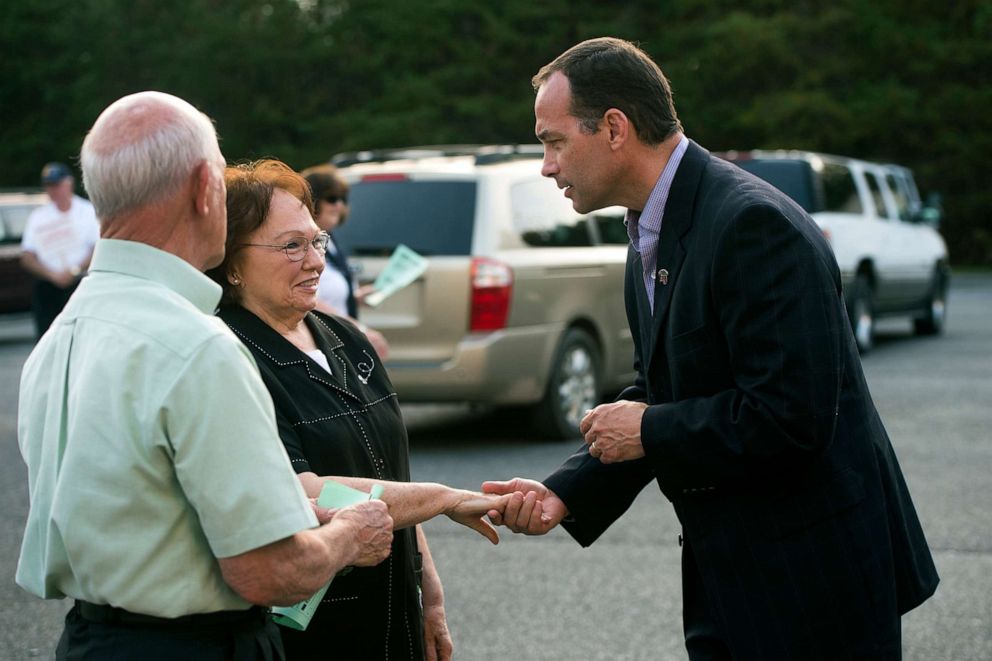 PHOTO: In this Nov. 3, 2015 file photo Republican candidate Bob Good, right, greets voters as they arrive at the Moose Lodge in Lynchburg, Va.