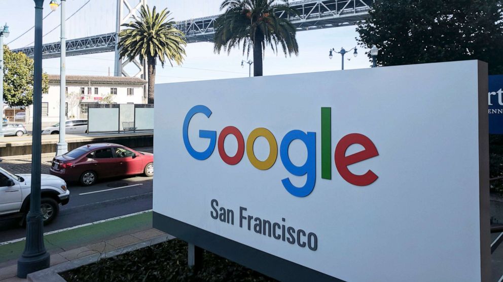 PHOTO: Signage outside the offices of Google in San Francisco with the San Francisco-Oakland Bay Bridge in the background.