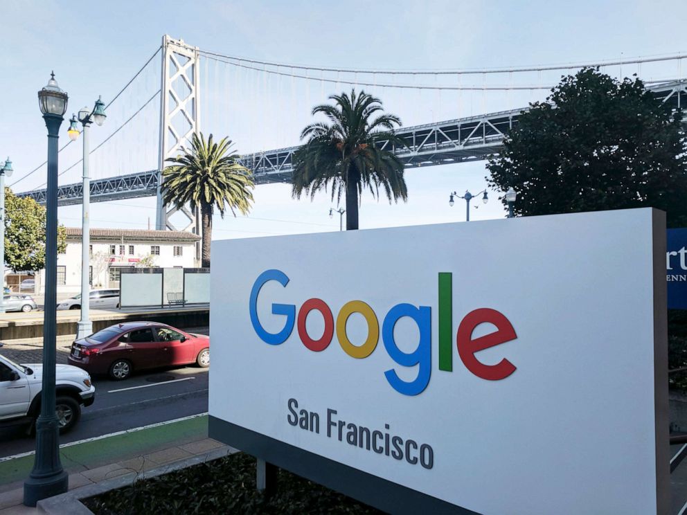 PHOTO: Signage outside the offices of Google in San Francisco with the San Francisco-Oakland Bay Bridge in the background.