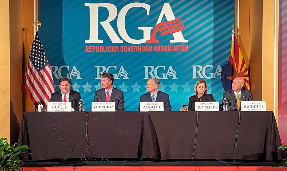PHOTO: Gov. Doug Ducey, left, speaks to reporters while Gov.-elect Glen Youngkin, of Virginia, Govs. Greg Abbott, of Texas, and Kim Reynolds and Pete Ricketts, of Nebraska, listen at the Republican Governors Association meeting in Phoenix, Nov. 17, 2021.