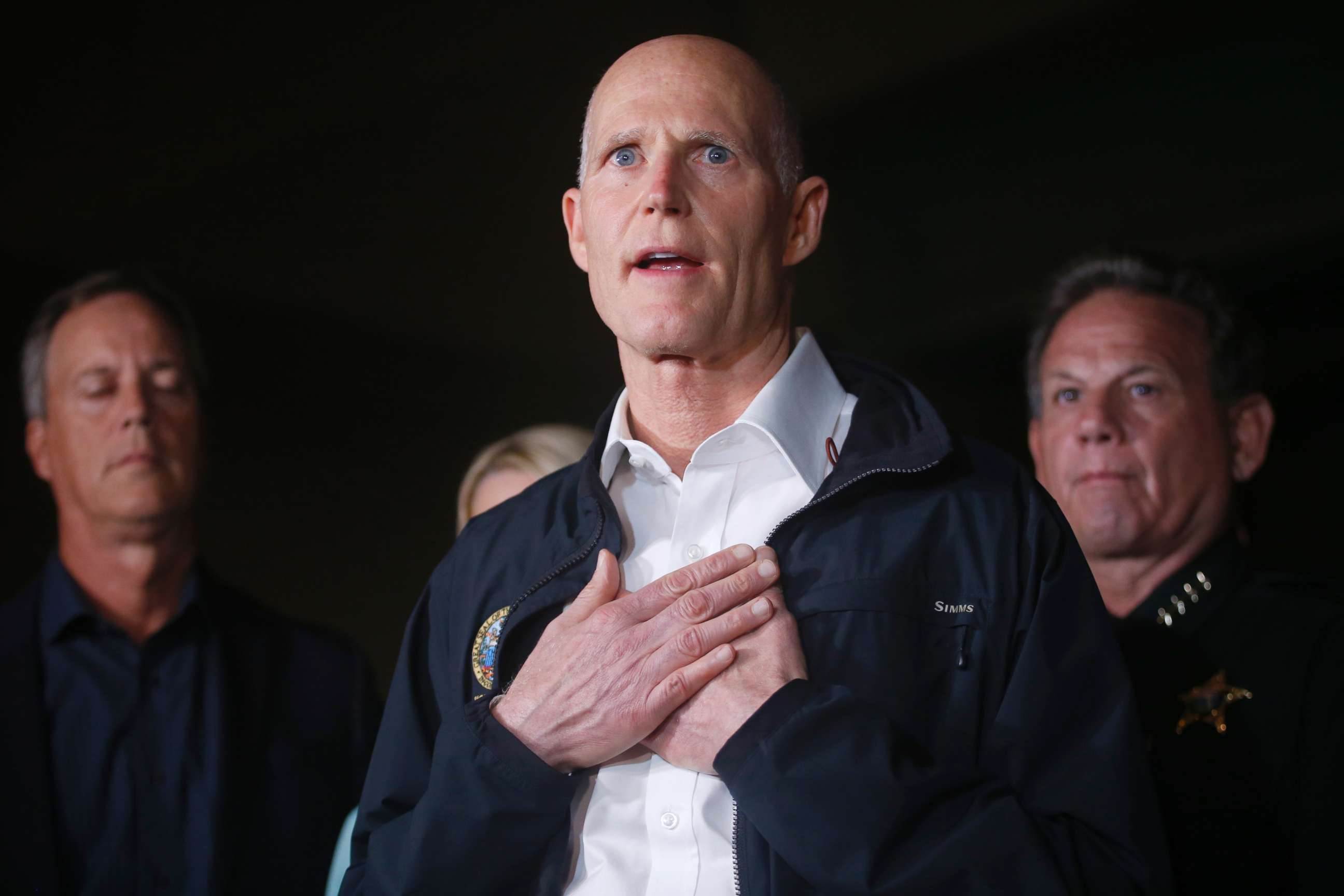 PHOTO: Florida Gov. Rick Scott gestures as he speaks during a news conference near Marjory Stoneman Douglas High School in Parkland, Fla., where a former student is killed at least 17 people on Feb. 14, 2018.