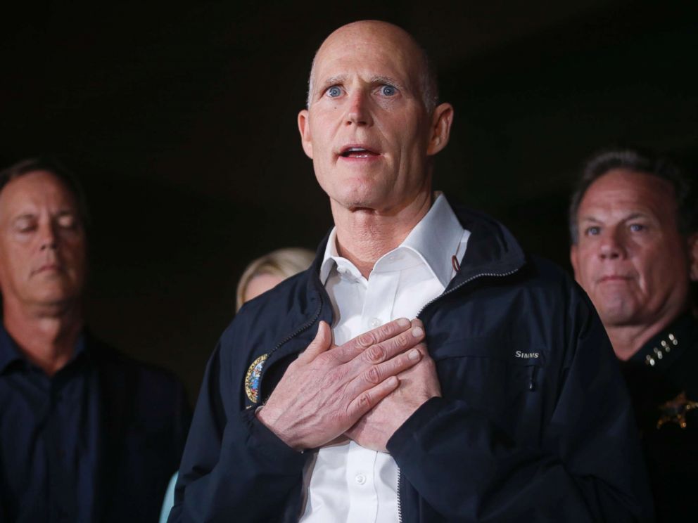 PHOTO: Florida Gov. Rick Scott gestures as he speaks during a news conference near Marjory Stoneman Douglas High School in Parkland, Fla., where a former student is killed at least 17 people on Feb. 14, 2018.