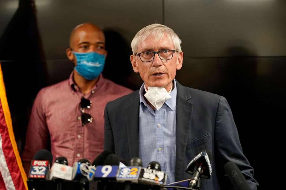 PHOTO: Wisconsin Governor Tony Evers speaks during a news conference, Aug. 27, 2020, in Kenosha, Wis. The city has suffered from unrest in the wake of the police shooting of Jacob Blake. Lt. Gov. Mandela Barnes is at rear.