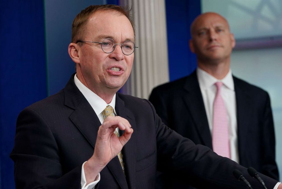 PHOTO: Office of Management and Budget Director Mick Mulvaney, left, speaks as Legislative Affairs Director Marc Short, right, looks on during a press briefing at the White House on Jan. 20, 2018. 