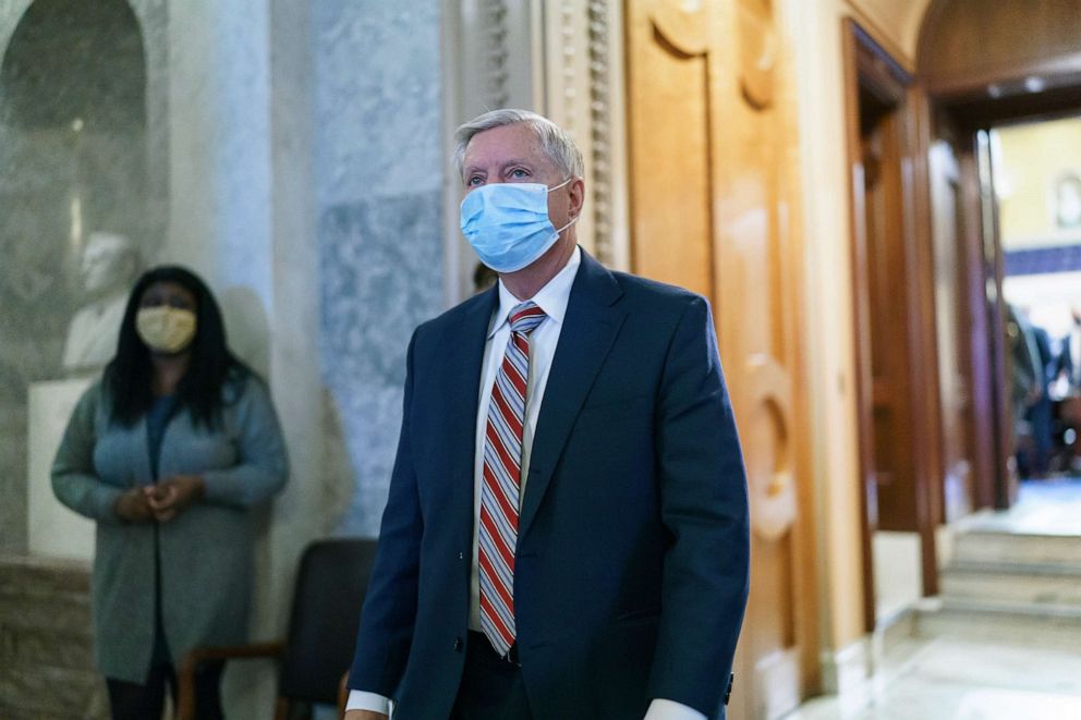 PHOTO: Sen. Lindsey Graham, R-S.C., leaves the chamber after taking an oath and voting on how to proceed on the impeachment against Trump, at the Capitol, Jan. 26, 2021.