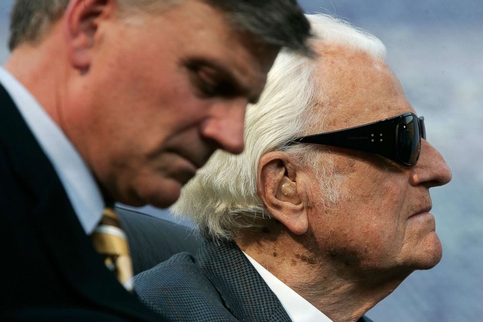 PHOTO: Evangelist Billy Graham (R) and his son Franklin (L) take part in the Metro Maryland 2006 Festival, July 9, 2006, in Baltimore. 