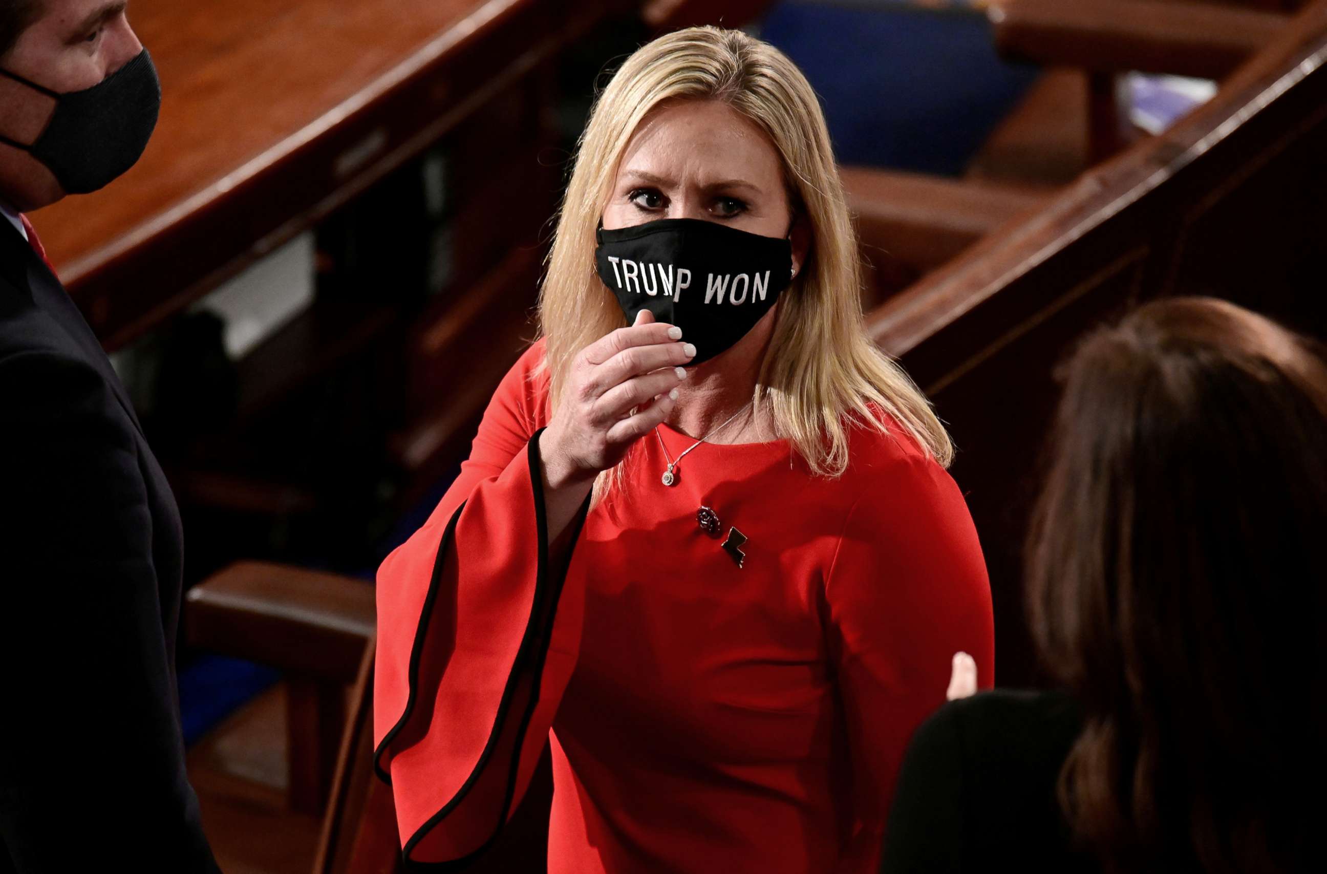 PHOTO: Rep. Marjorie Taylor Greene wears a "Trump Won" face mask as she arrives on the floor of the House to take her oath of office as a newly elected member of the 117th House of Representatives in Washington, D.C., Jan. 3, 2021.