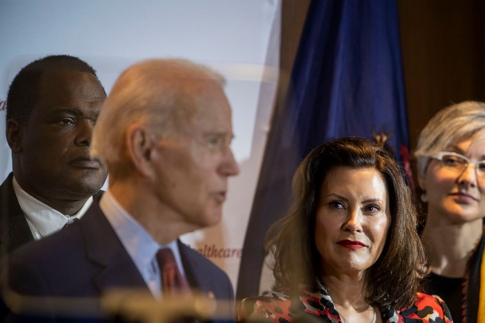 PHOTO: Former Vice President Joe Biden speaks as Michigan Governor Gretchen Whitmer looks on at an event at Cherry Health in Grand Rapids, Mich., March 9, 2020.