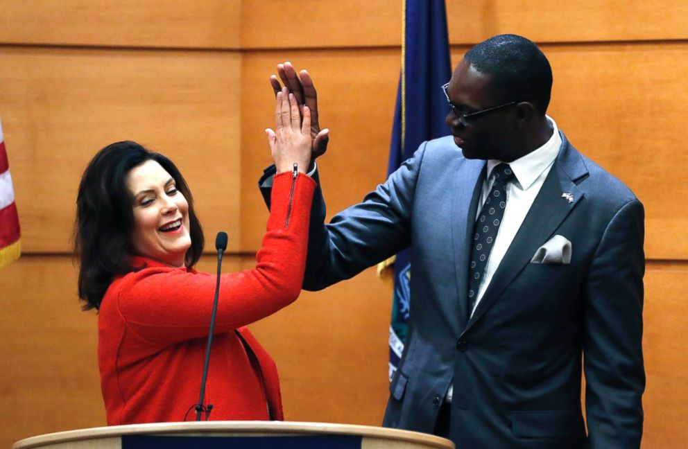 PHOTO: Michigan Gov.-elect Gretchen Whitmer high-fives Lt. Gov.-elect Garlin Gilchrist II during their post-election news conference in Detroit, Nov. 7, 2018.