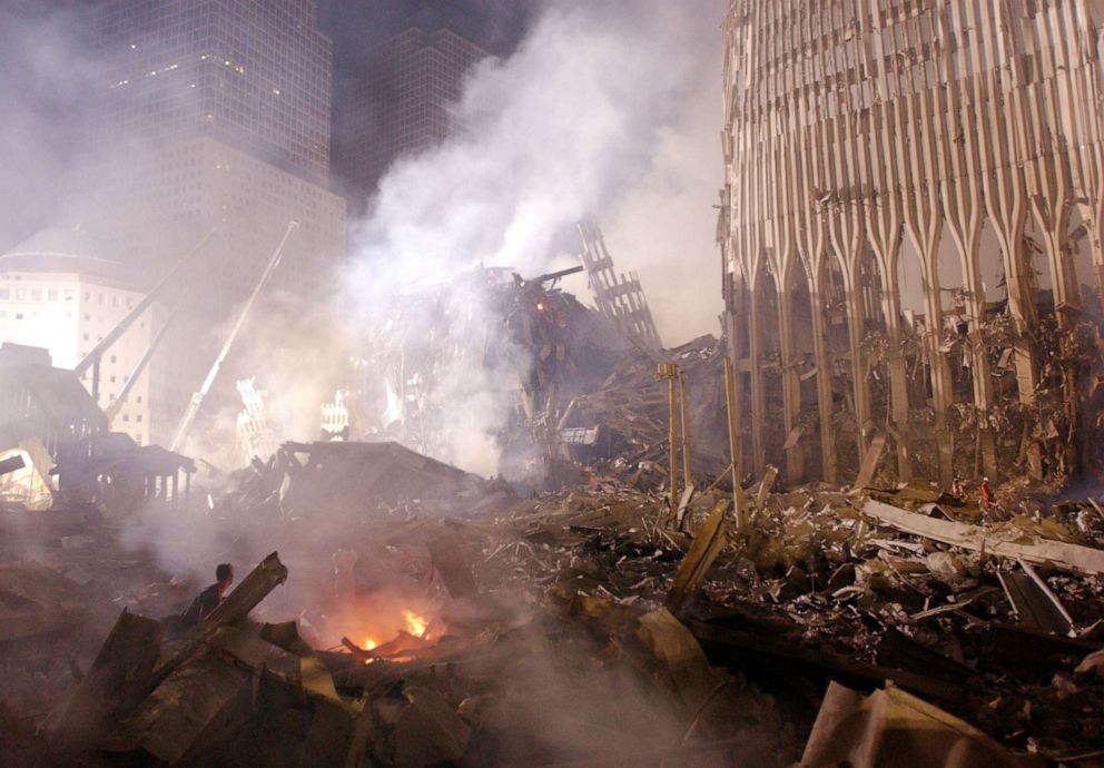 PHOTO: Rubble burns at the remains of the destroyed World Trade Center towers Sept. 12, 2001, in New York.