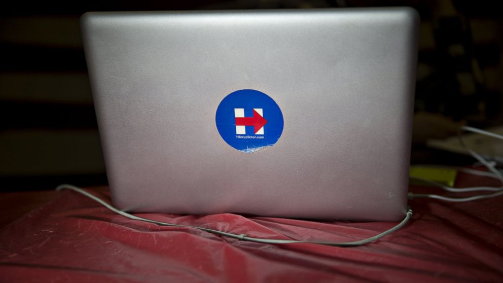 A campaign sticker for Hillary Clinton sticks to an Apple laptop computer at the Clinton campaign field office in Portsmouth, New Hampshire,  Feb. 4, 2016. 
