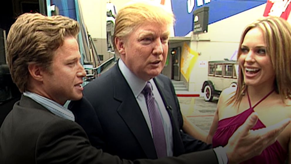 PHOTO: In this 2005 frame from video, Donald Trump (center) prepares for an appearance on 'Days of Our Lives' with actress Arianne Zucker (right). He is accompanied to the set by Access Hollywood host Billy Bush (left).