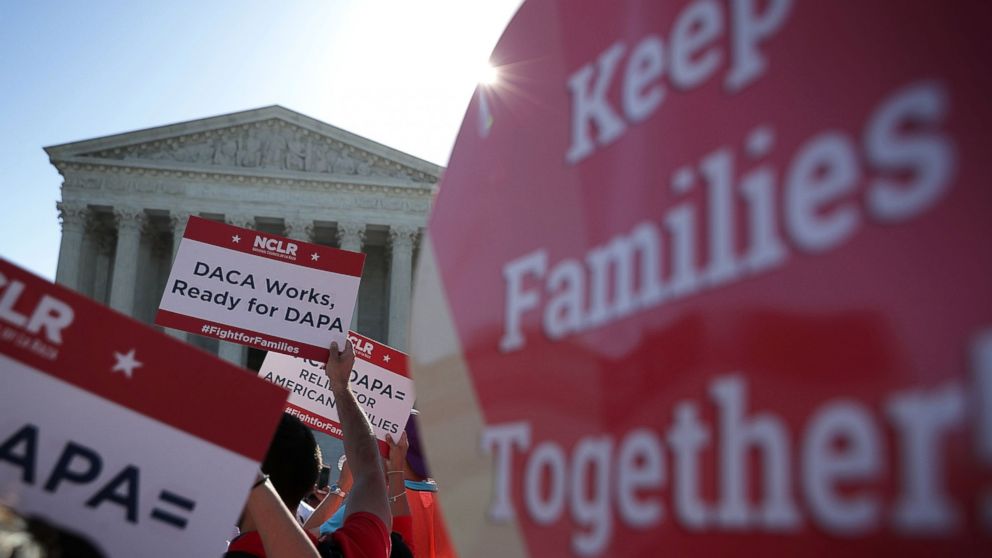 Pro-immigration activists gather in front of the U.S. Supreme Court, April 18, 2016, in Washington. The Supreme Court is scheduled to hear oral arguments in the case of United States v. Texas, which is challenging President Obama's 2014 executive actions on immigration - the Deferred Action for Childhood Arrivals (DACA) and Deferred Action for Parents of Americans and Lawful Permanent Residents (DAPA) programs.