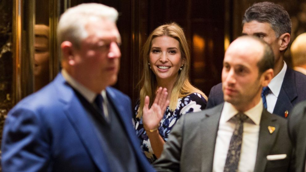PHOTO: Ivanka Trump(C) waves from the elevator as former US Vice President Al Gore(L) leaves meetings at Trump Tower in New York City, Dec. 5, 2016.