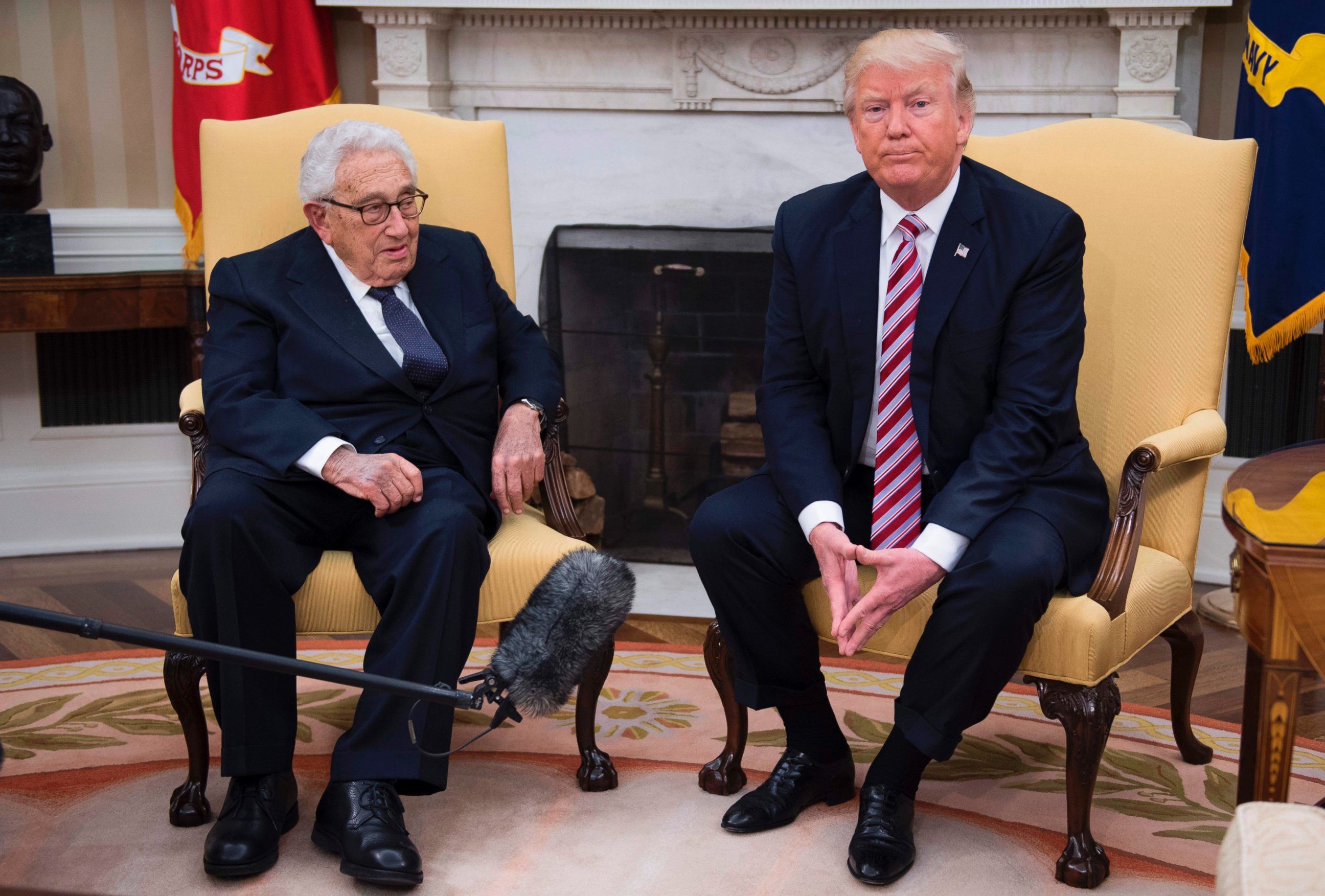 PHOTO: US President Donald Trump speaks with former Secretary of State Henry Kissinger during a meeting in the Oval Office of the White House in Washington, May 10, 2017.