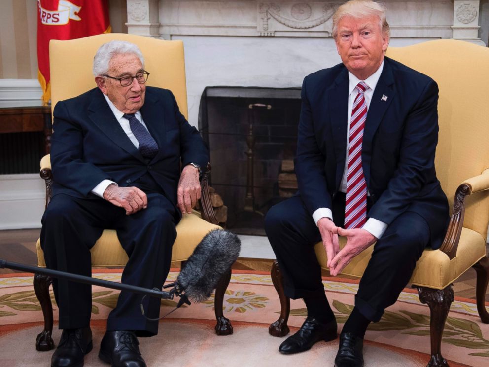 PHOTO: US President Donald Trump speaks with former Secretary of State Henry Kissinger during a meeting in the Oval Office of the White House in Washington, May 10, 2017.