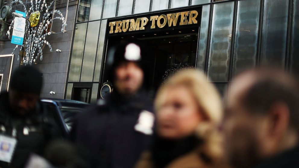 PHOTO: People stand outside of Trump Tower during a press conference on Dec. 9, 2016 in New York.