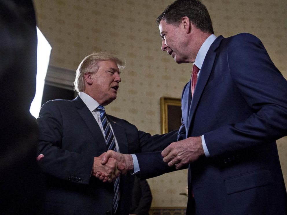 PHOTO: President Donald Trump shakes hands with James Comey, director of the FBI, during areception in the Blue Room of the White House in Washington, D.C., Jan. 22, 2017.