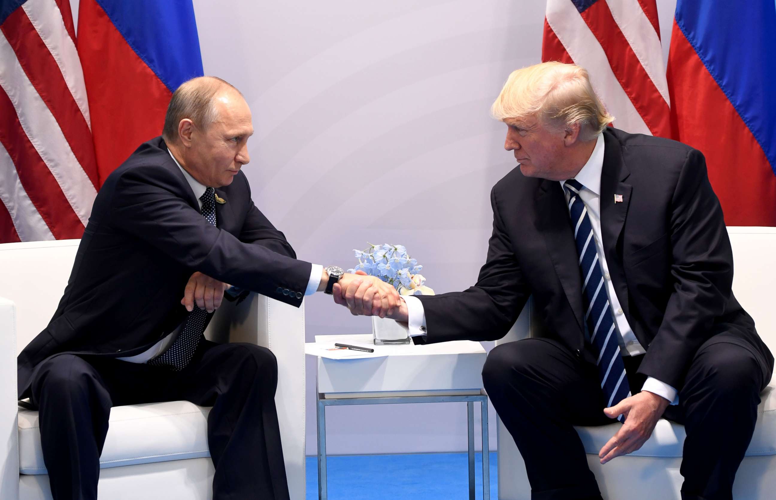 PHOTO: President Donald Trump and Russia's President Vladimir Putin shake hands during a meeting on the sidelines of the G20 Summit in Hamburg, July 7, 2017.