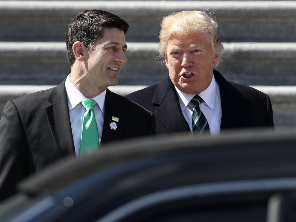 PHOTO: President Donald Trump confers with U.S. Speaker of the House Paul Ryan (R-WI) following a luncheon celebrating St. Patrick's Day at the Capitol, March 16, 2017. 