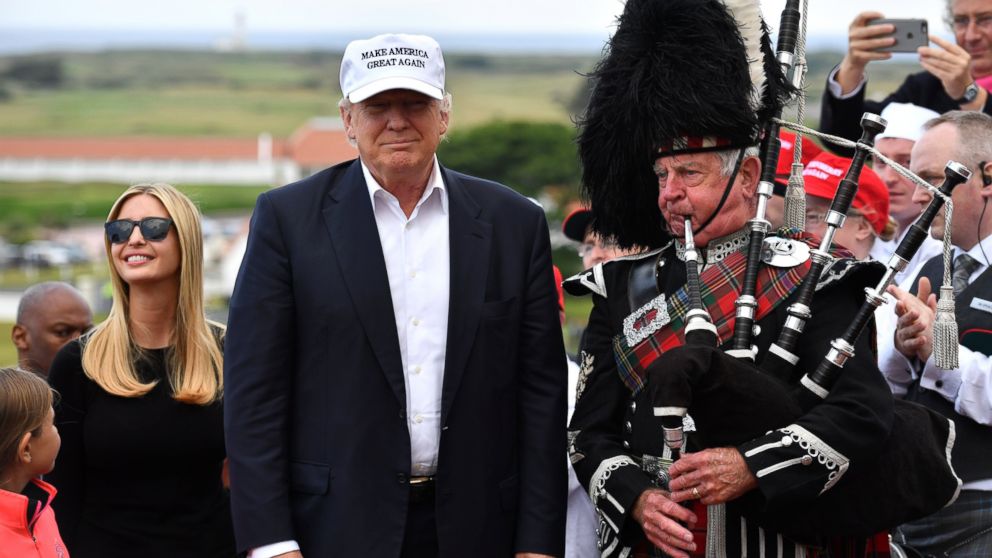 PHOTO: A bagpipe player wears traditional dress next to Donald Trump and his family as they arrive to his Trump Turnberry Resort, June 24, 2016, in Ayr, Scotland.
