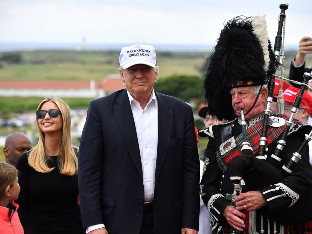 PHOTO: A bagpipe player wears traditional dress next to Donald Trump and his family as they arrive to his Trump Turnberry Resort, June 24, 2016, in Ayr, Scotland.