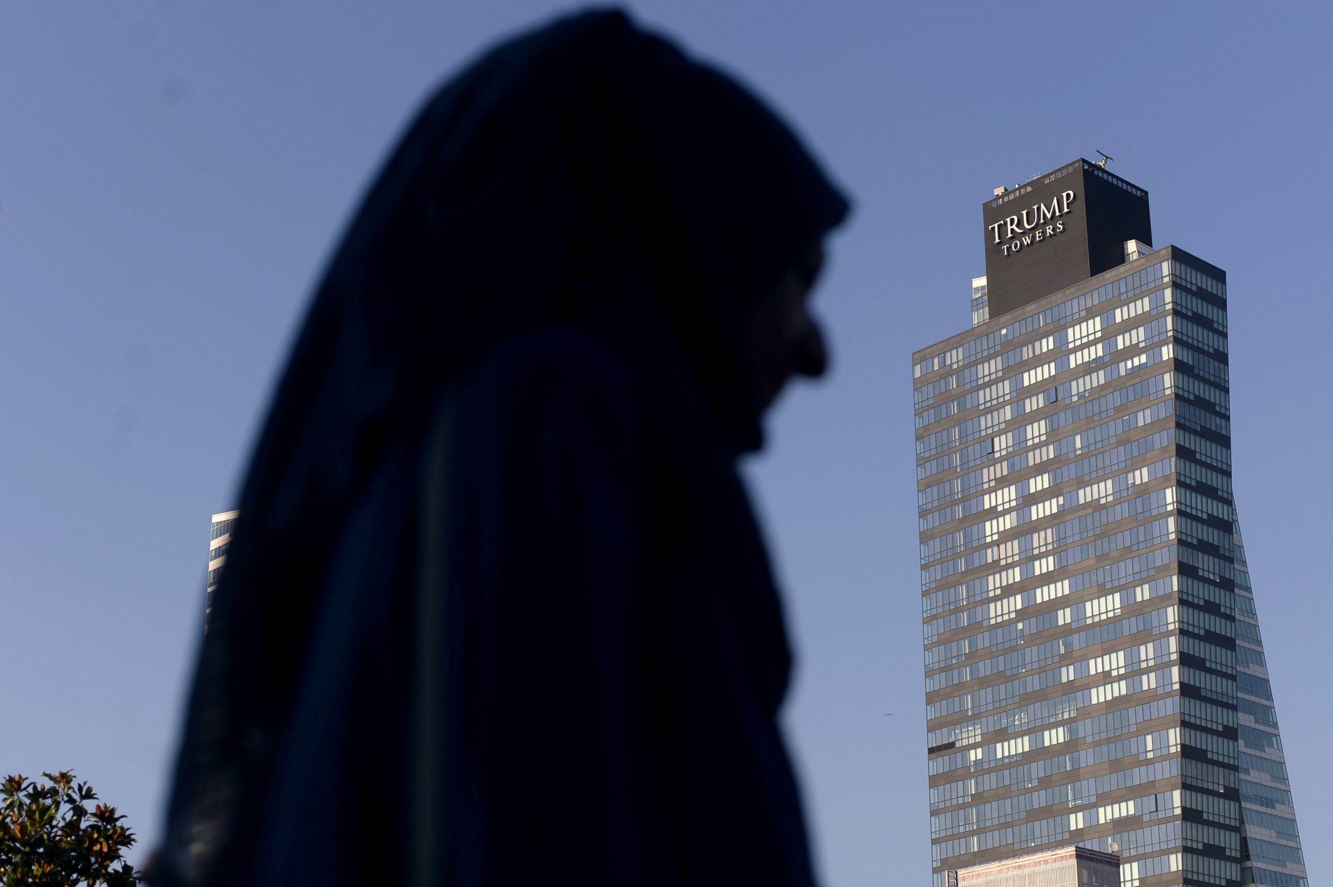 PHOTO: A woman walks past the Trump Towers building in Istanbul on July 30, 2015.