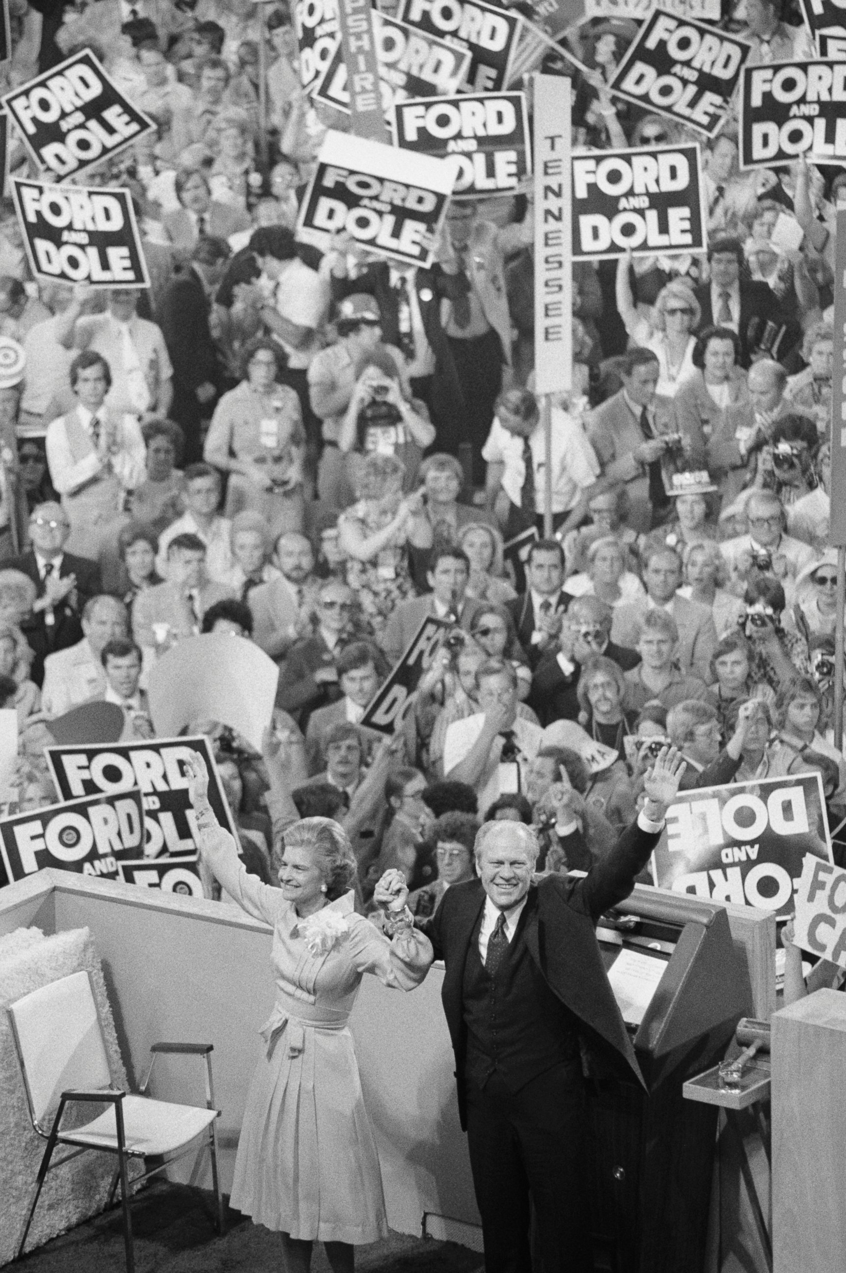 PHOTO: President Gerald Ford, holding hands with his wife Betty, turns to the cheering crowd behind the podium at the closing session of the GOP convention, Aug. 19, 1976.