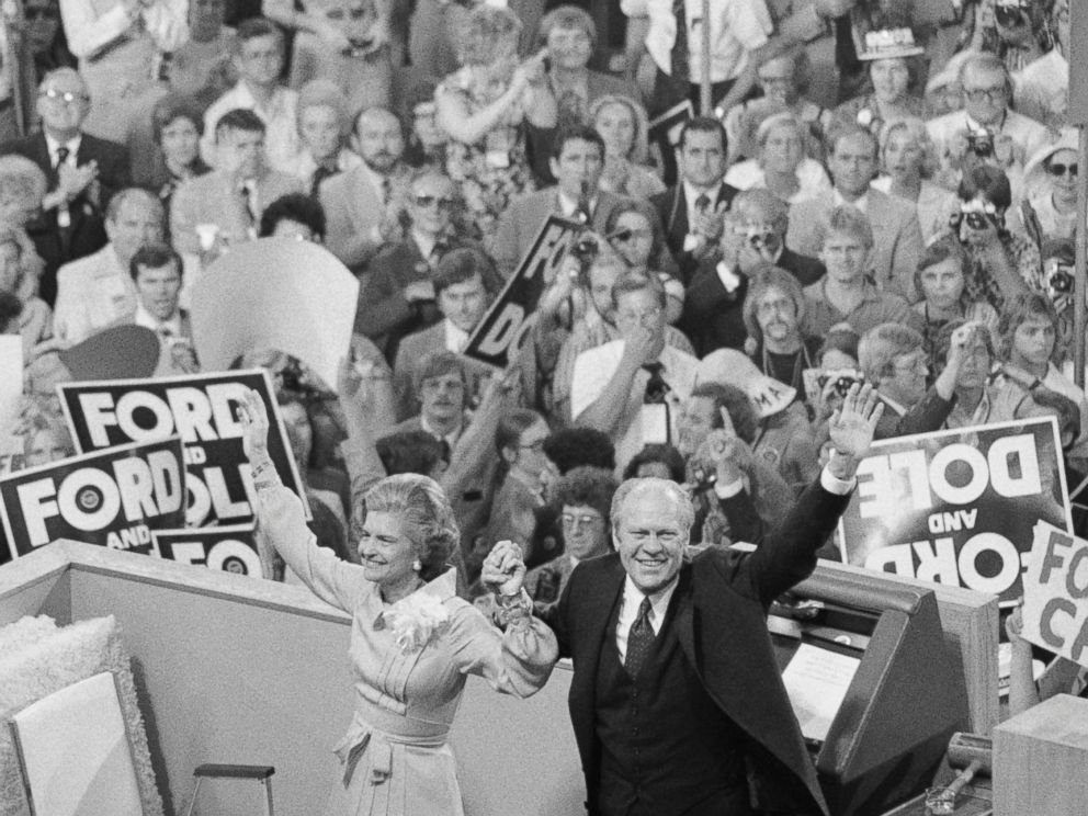 PHOTO: President Gerald Ford, holding hands with his wife Betty, turns to the cheering crowd behind the podium at the closing session of the GOP convention, Aug. 19, 1976.