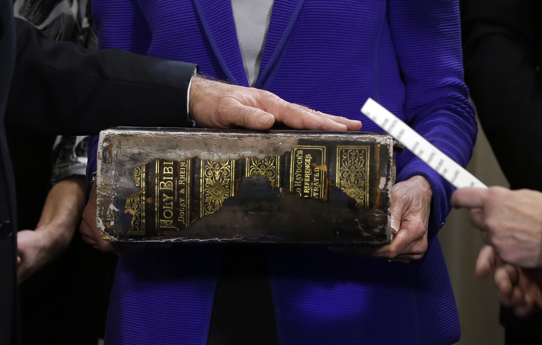 PHOTO: U.S. Vice President Joe Biden places his hand on the Biden Family Bible as he takes the oath of office during his official swearing-in ceremony at the Naval Observatory on Jan. 20, 2013 in Washington, DC.