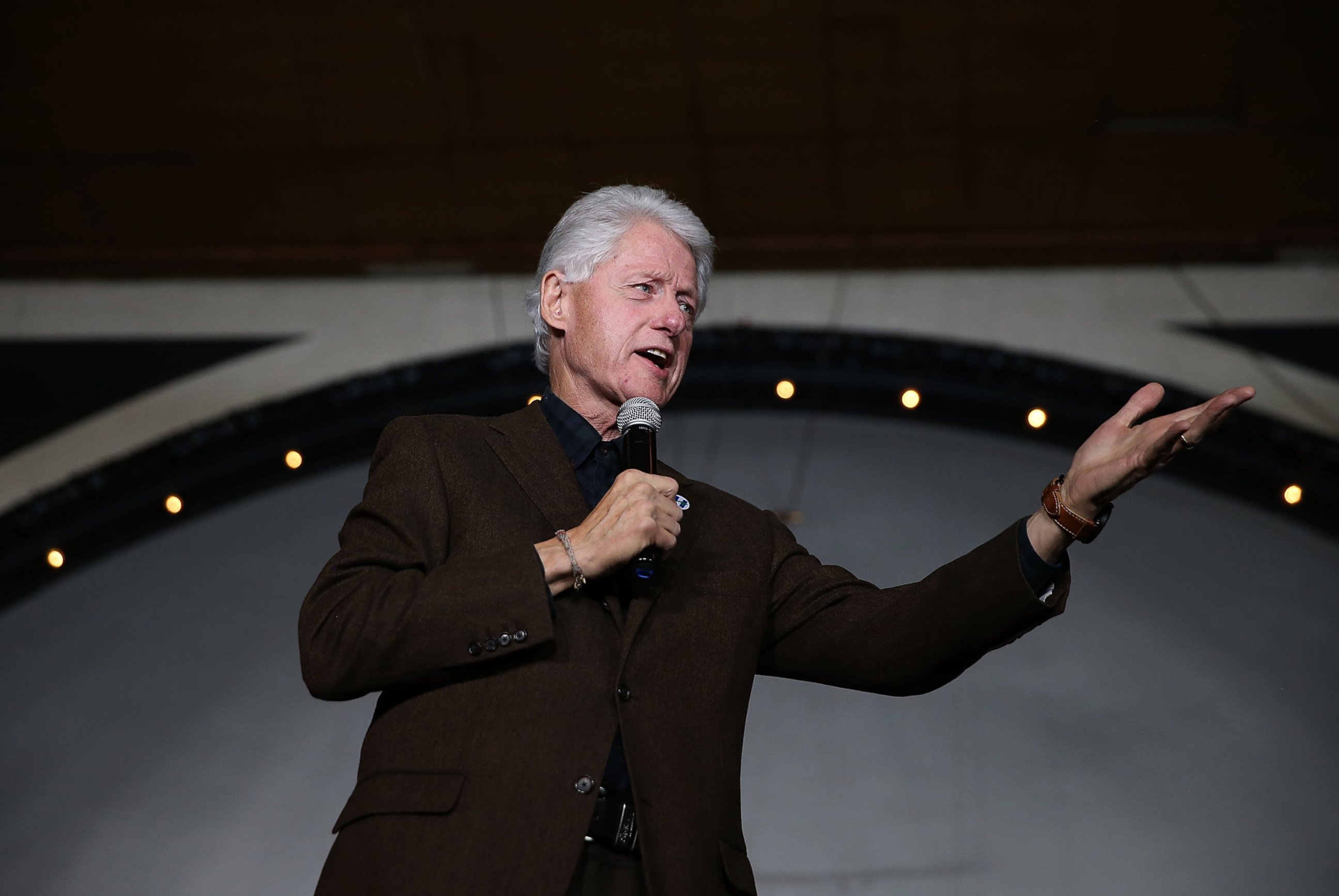 PHOTO: Former president Bill Clinton speaks during a "get out the caucus" event for his wife, democratic presidential candidate former Secretary of State Hillary Clinton, in Davenport, Iowa on January 29, 2016. 