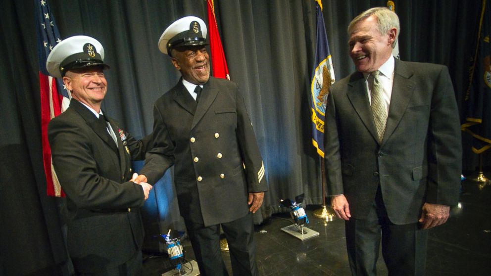 PHOTO: In this handout photo provided by the U.S. Navy, Master Chief Petty Officer of the Navy Rick West and Secretary of the Navy the Honorable Ray Mabus congratulate Honorary Chief Hospital Corpsman Bill Cosby on Feb. 17, 2011 in Washington, DC.