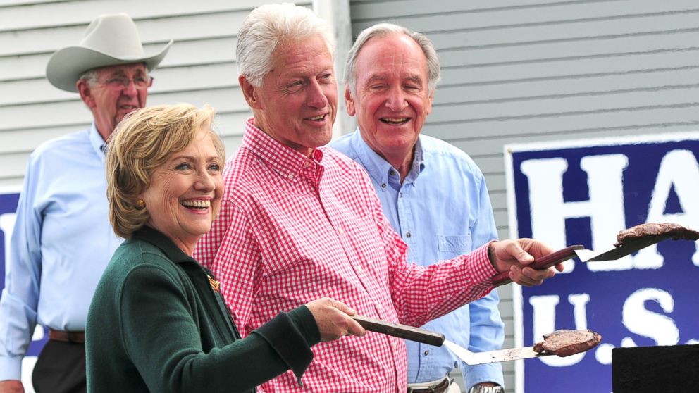 Former President Bill Clinton and his wife, former Secretary of State Hillary Rodham Clinton flip steaks at the 37th Harkin Steak Fry, Sept. 14, 2014 in Indianola, Iowa.