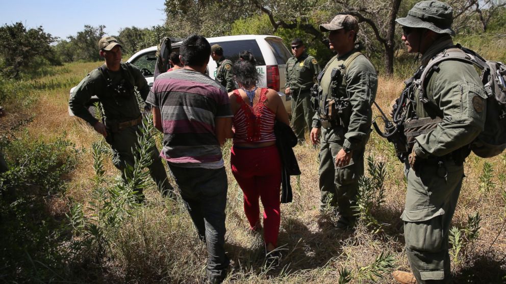 PHOTO: U.S. Border Patrol agents detain undocumented immigrants with the help of helicopter support from the U.S. Office of Air and Marine north of the U.S. and Mexico border on Aug. 6, 2015 near Falfurrias, Texas. 