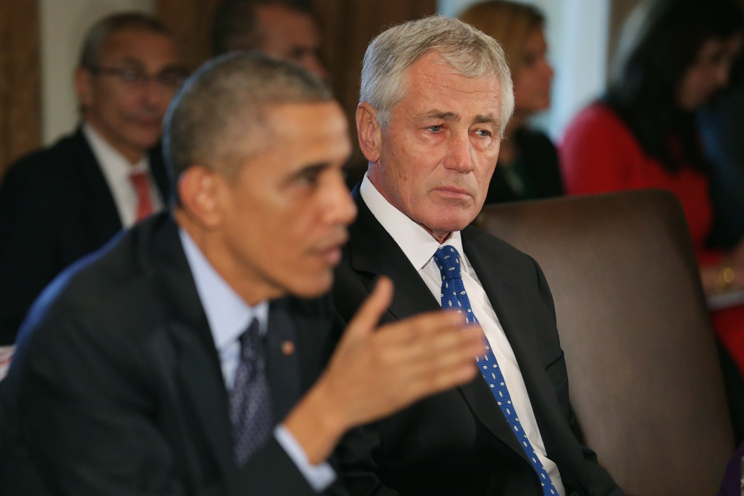 PHOTO: Defense Secretary Chuck Hagel, right, listens as President Barack Obama speaks to members of the news media.