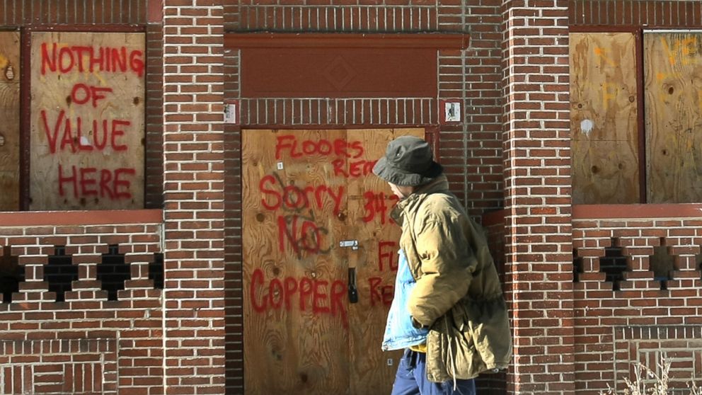 PHOTO: A resident walks past a boarded up building in the Mount Pleasant section of Cleveland, Ohio, Jan. 25, 2008.