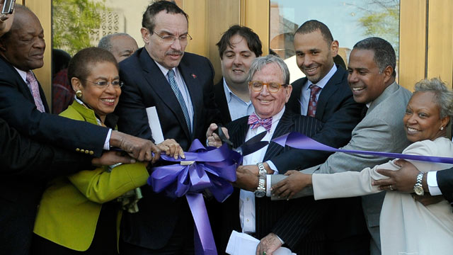 PHOTO: Council member Marion Barry, Congresswoman Eleanor Holmes-Norton, mayor Vincent Gray, council member Jim Graham, Malik and Chip Ellis of Ellis
Development, Myla Moss are seen cutting the ribbon during the official opening at the Howard Theatre on A