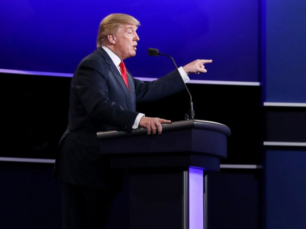 PHOTO: Republican presidential nominee Donald Trump speaks as Democratic presidential nominee Hillary Clinton looks on during the third U.S. presidential debate at the Thomas & Mack Center in Las Vegas, Oct. 19, 2016.