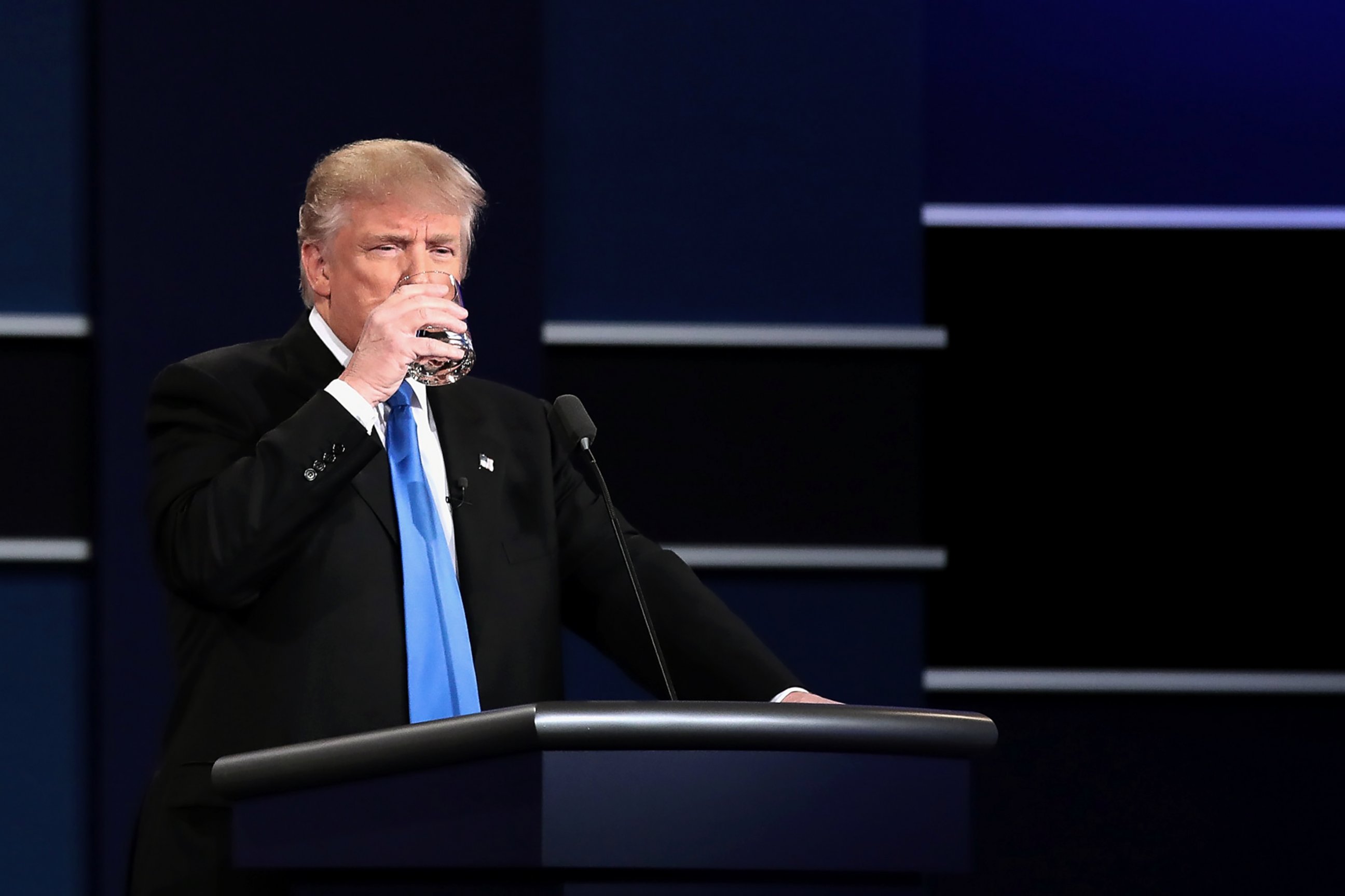 PHOTO: Republican presidential nominee Donald Trump drinks water during the Presidential Debate at Hofstra University on Sept. 26, 2016 in Hempstead, New York.  