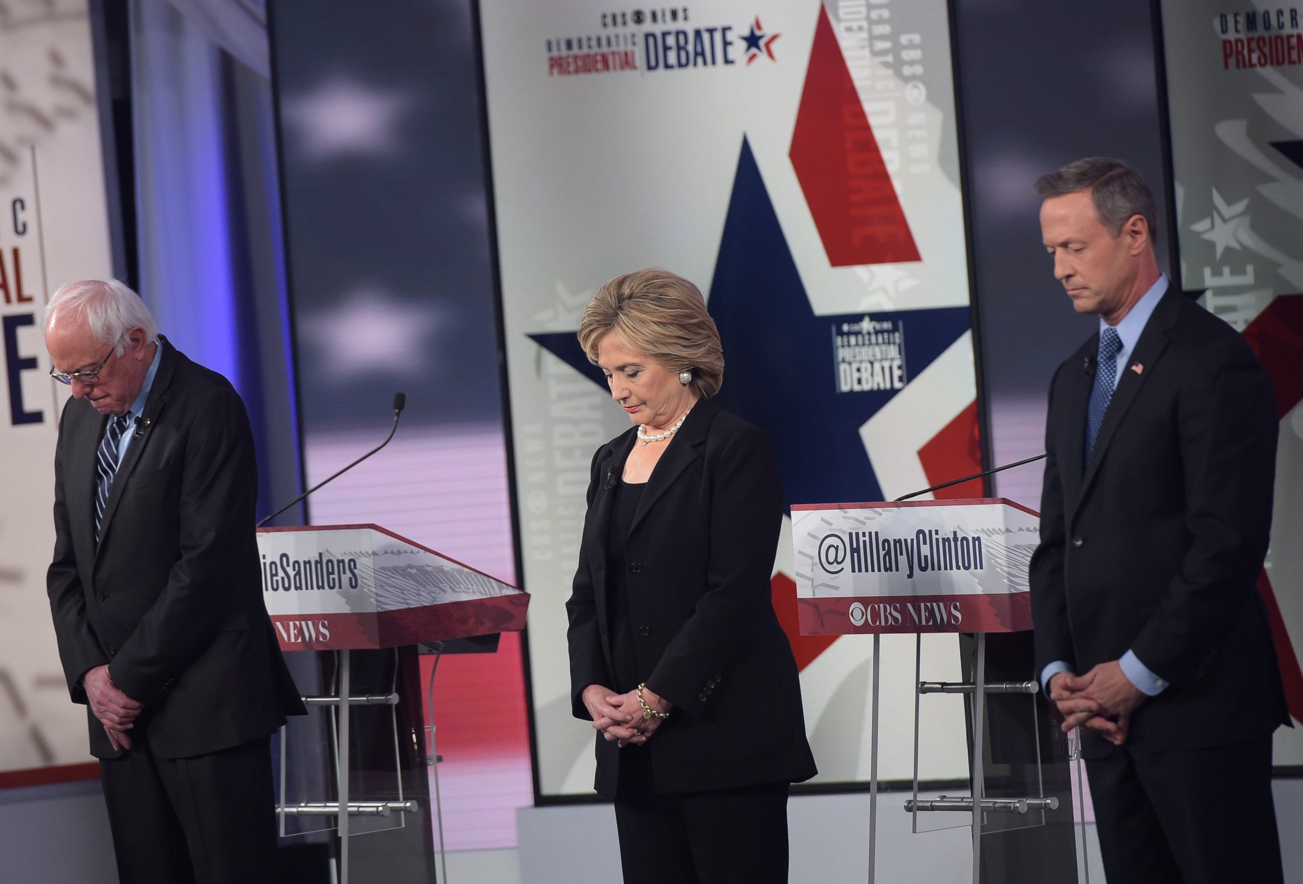 PHOTO:  Bernie Sanders, Hillary Clinton, and Martin OMalley pause for a moment of silence, for the victims of the Paris terrorists attacks, before the start of the second Democratic presidential primary debate on Nov. 14, 2015 in Des Moines, Iowa. 