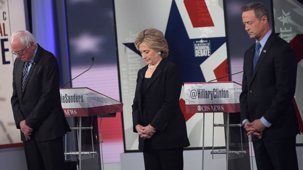  Bernie Sanders, Hillary Clinton, and Martin OMalley pause for a moment of silence, for the victims of the Paris terrorists attacks, before the start of the second Democratic presidential primary debate on Nov. 14, 2015 in Des Moines, Iowa. 