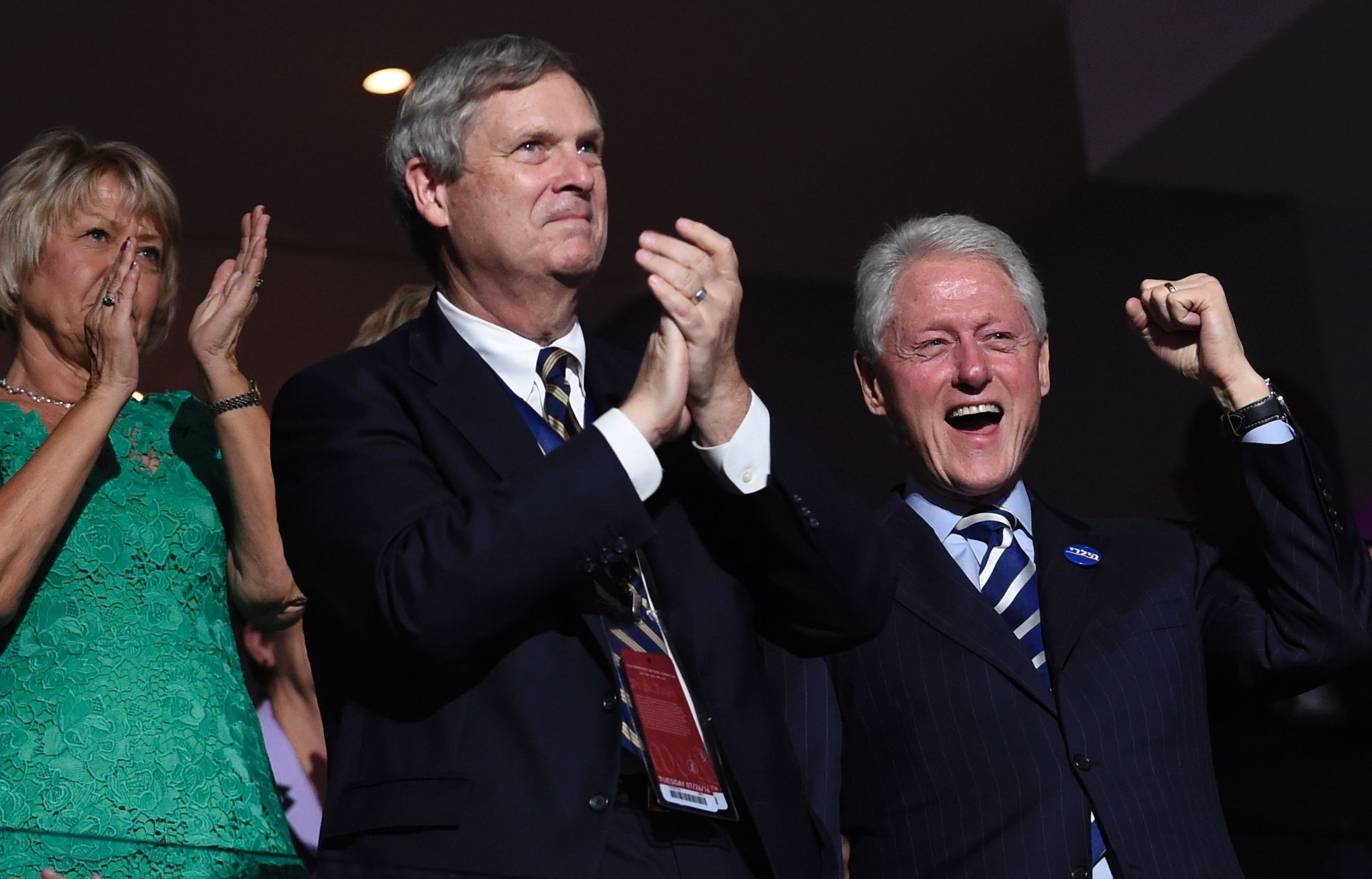 PHOTO: Former US president Bill Clinton (R) cheers as former New York City mayor Michael Bloomberg addresses the crowd on the third evening of the Democratic National Convention at the Wells Fargo Center in Philadelphia, Pennsylvania, July 27, 2016. 
