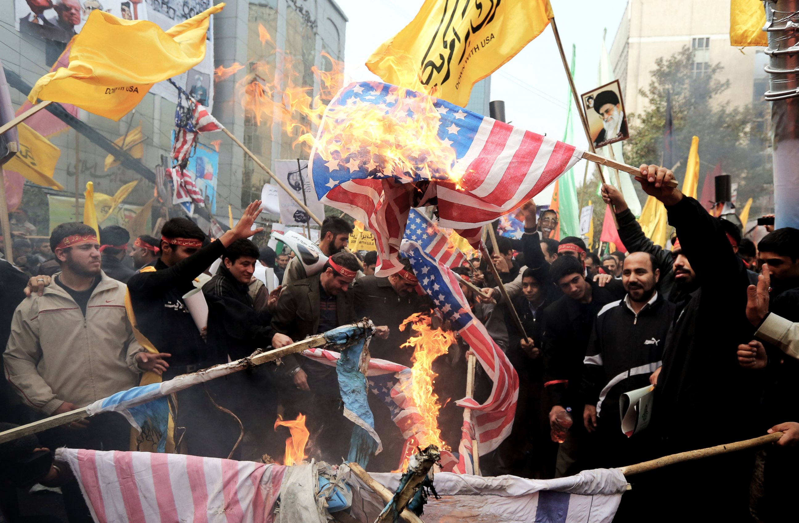 PHOTO: Iranians burn US flags outside the former US embassy in Tehran on Nov. 4, 2013, during a demonstration to mark the 34th anniversary of the 1979 US embassy takeover.