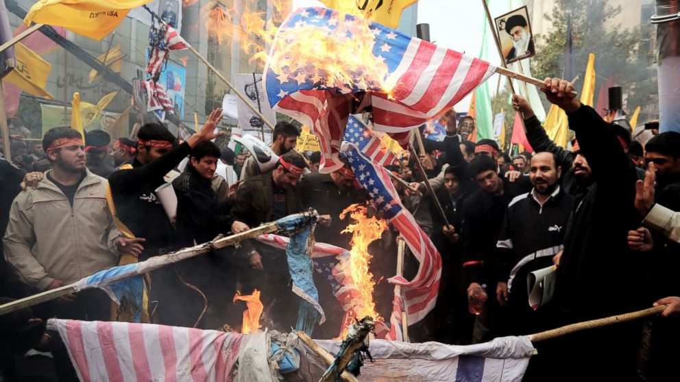 PHOTO: Iranians burn US flags outside the former US embassy in Tehran on Nov. 4, 2013, during a demonstration to mark the 34th anniversary of the 1979 US embassy takeover.