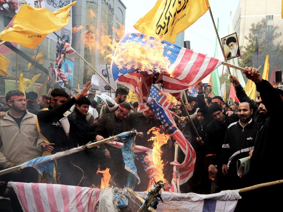 PHOTO: Iranians burn US flags outside the former US embassy in Tehran on Nov. 4, 2013, during a demonstration to mark the 34th anniversary of the 1979 US embassy takeover.